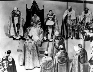 Coronation Day - The Queen dressed in the magnificent Royal Rose cloth of God receives
