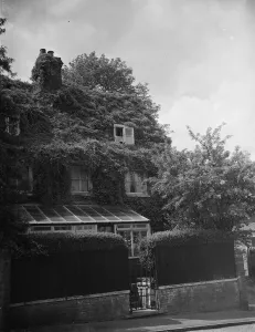 The front of a cottage in Sevenoaks covered in ivy. 1938