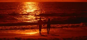 Couple on a beach in Barbados, sunset