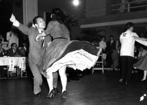Couple energetically Dancing jive or jitterbug 1950s dance / dancing / party