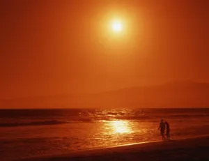 Evening Prints: Couple on tropical beach, shortly before sunset
