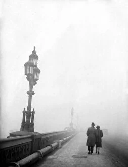 Romance Collection: Couple walking across a bridge in London in fog 1950s love couple romance romantic