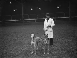 Stadium Prints: At the Crayford greyhound stadium. The track manager with two of the greyhounds