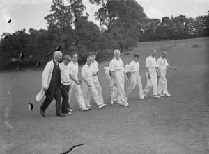 Cricket scenes in Wilmington, Kent. Veteran cricketers walk togeather. The veterans