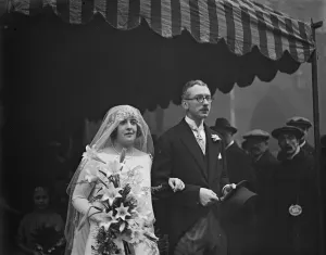 Former cricketers daughter weds. Mr A K Guiness, of Clandon Regis, Guildord