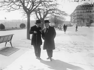 The crisis at Geneva. Dr Luther and M Vandervelde walking by the lakeside in discussion
