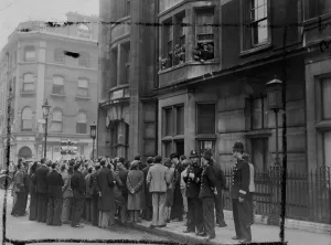 Living Conditions Prints: A crowd gathered outside the Ivanhoe hotel, Bloomsbury, London today. To listen to