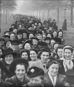 Crowds, most of them women stretched into a three sides of the square around St James s
