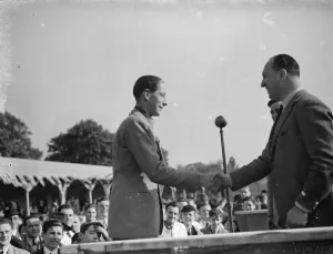 The Crystal Palace Road Racing. J H T Smith, the racing car driver, receiving