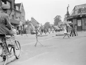 Maintenance Prints: A cyclist negotiates a road barricade for road works in Bromley, Kent