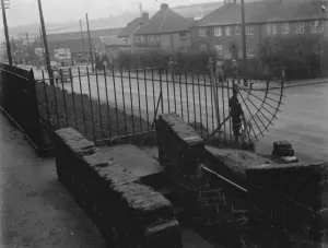A dangerous footway in Crayford, Kent. 1936