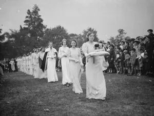 Crown Prints: The Dartford Carnival Queen with her attendees arriving for the queens coronation. 1938