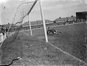 Dartford versus Guildford football match. Goal mouth action, the goalkeeper dives