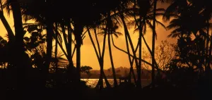 Paradise Prints: Dawn over Tobago, with boat in foreground. North Bay