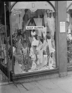 Shop Window Prints: A Dawsons shop front advertising that they have Air Raid Precautions ( ARP ) outfits
