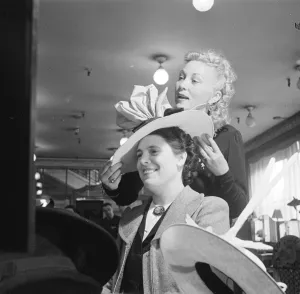 Salesgirl Prints: Day in the life of a Midinette. A Parisian salesgirl, selling hats. 1930s