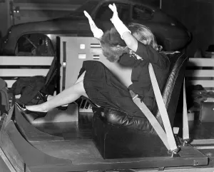 Demonstration of car safety belt at the National Racing Car Show at the Royal Horticultural Hall