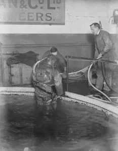 Demonstration of divers at work at Siebe. Gorman and Cos tanks at Westminster