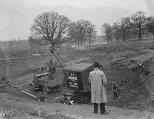 Digging Prints: Digger clears the land and puts soil into the back of Bedford truck, on the site