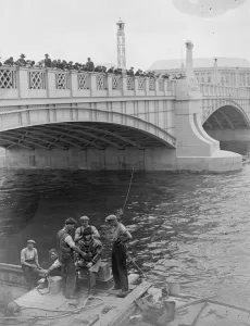 Diving in the Thames. A large crowd watched a diver Mr W R Gloss descend to