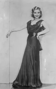 Draped neckline for evening wear. Beautiful Adrrenne Lore wearing a gown of double