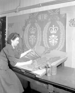 Textiles Prints: Draughtswoman Miss June Swindells working on designs for the draperies for the Coronation