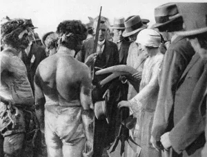 The Duke and Duchess of York face to face with typical Australian aboriginals, inspecting
