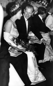 The Duke of Edinburgh turns to talk with H M The Queen Elizabeth II as they take