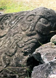 Easter Island - Orongo petroglyphs, including a humanoid face, on the sacred rocks Easter Island - Orongo petroglyphs, including a humanoid face, on the sacred rocks