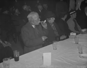 Drinking Prints: An elderly gentleman smokes his clay pipe at the old folks party at Crayford, Kent