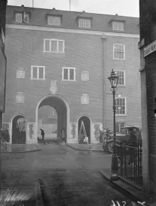 Empire students home new buildings to be opened by Queen Mary. Men are working day