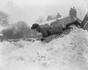 Englands winter sports in full swing. The tobogganning girl at the start of