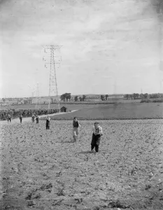 Erecting electricity pylon wires on a grid in Gravesend, Kent. 1939