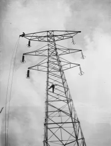 Erecting electricity pylon wires on a grid in Gravesend, Kent. 1939