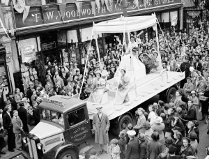 Crown Prints: Erith carnival queen sitting on her throne on the back of a lorry at the procession