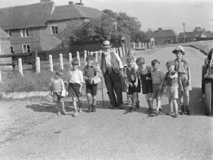 Evacuated children in Wye, Kent, walking down a country road. 1939 / 40