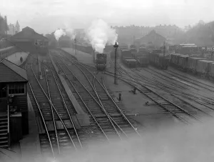 Topography Prints: Exeter taken from Railway Bridge showing up side of Station. ? TopFoto