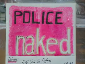 Shop Window Prints: Eye-catching pink poster advertising Police Naked eau de parfum, a new perfume with