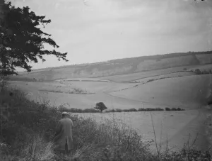 Farmer Prints: A farmer stands to view his fields at Preston hill farm estate. 3 February 1938