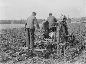 Farm Prints: A farmer and his tractor at work in a field. 1935