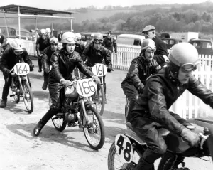 Female motorcyclist, Brenda Bound, in full leathers at a local race meeting, Kent