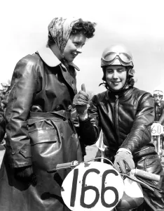 Female motorcyclist, Brenda Bound, in full leathers at a local race meeting, Kent