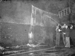 Firemen Prints: Fire, Halls, Dartford. Firemen dampening down the burnt - out building