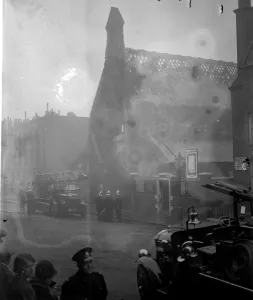 Firemen fight fire at London church. A hundred firemen with twenty engines were