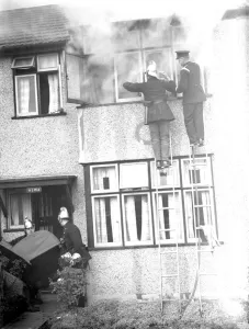 Firemen tend to a fire at Alma house on Old Farm Avenue in Sidcup, Kent