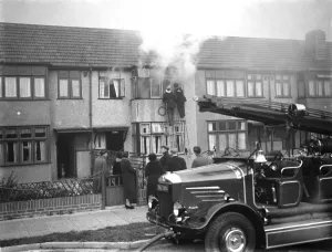 Firemen tend to a fire at Alma house on Old Farm Avenue in Sidcup, Kent