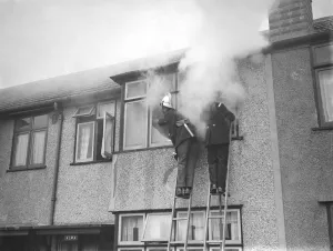 Nostalgia John Topham's Britain Prints: Firemen tend to a fire at Alma house on Old Farm Avenue in Sidcup, Kent