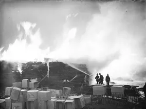 Firemen train their hoses on the flames at the timber fire at Welling in Kent