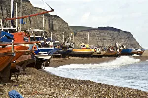 Harbour Collection: Fishing boats pulled up onto the shingle at Hastings, Sussex, UK credit: Marie-Louise