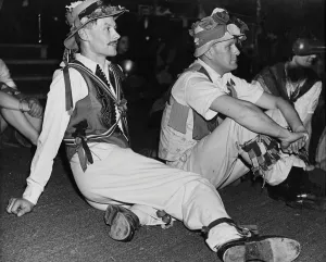 Celebration Prints: Folk Dance Festival. Lads from the country take a breather: their costumes are adorned